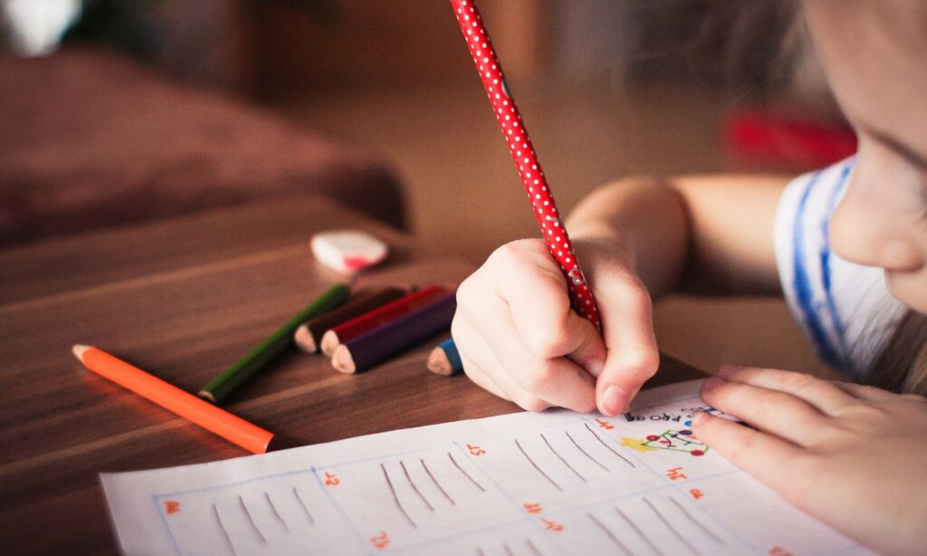 a child writing on paper