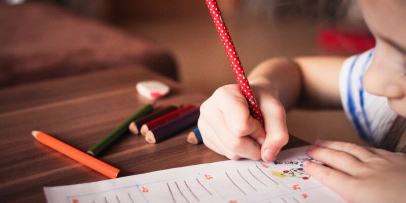 a child writing on paper