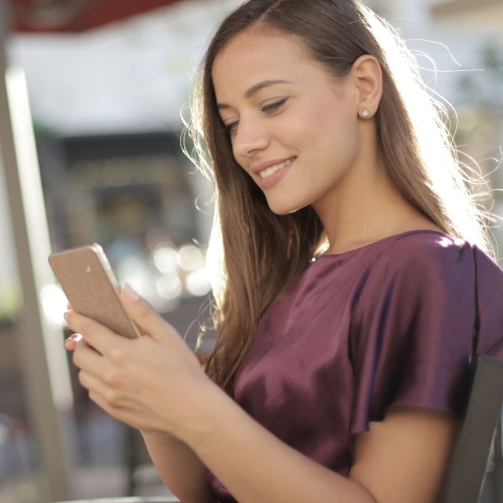 Woman looks at her phone 