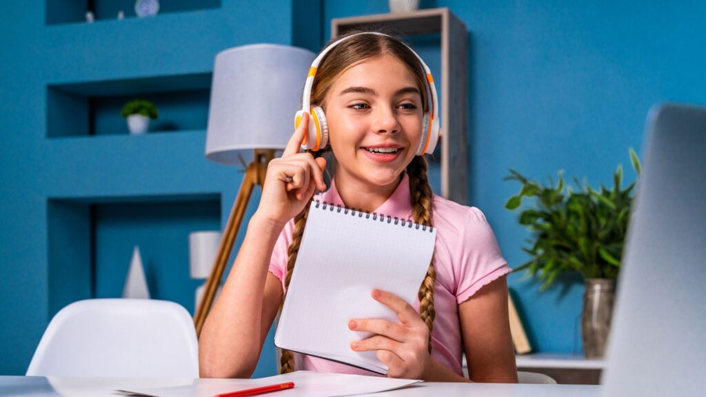 student smiling while learning online