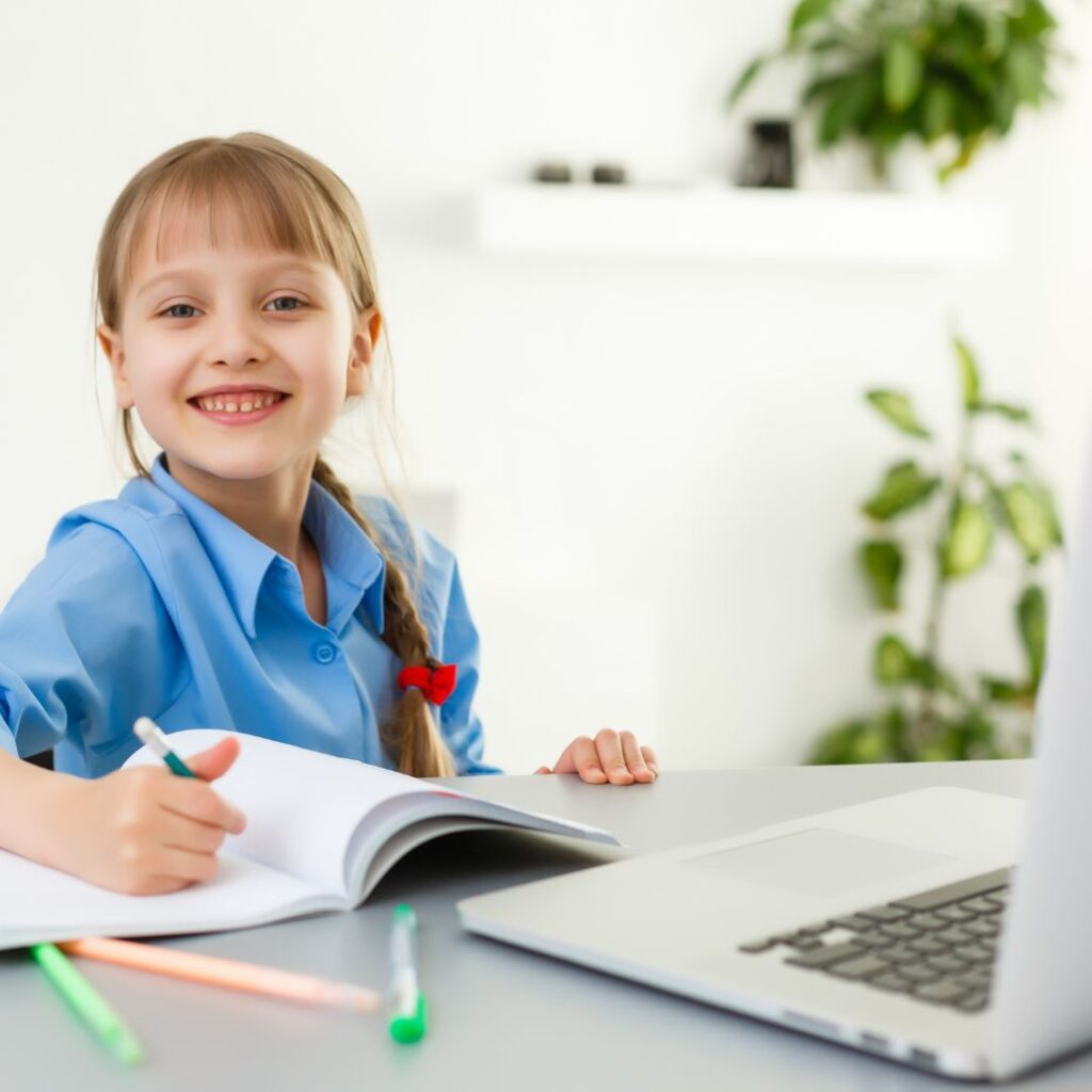 child smiling and taking a break from work