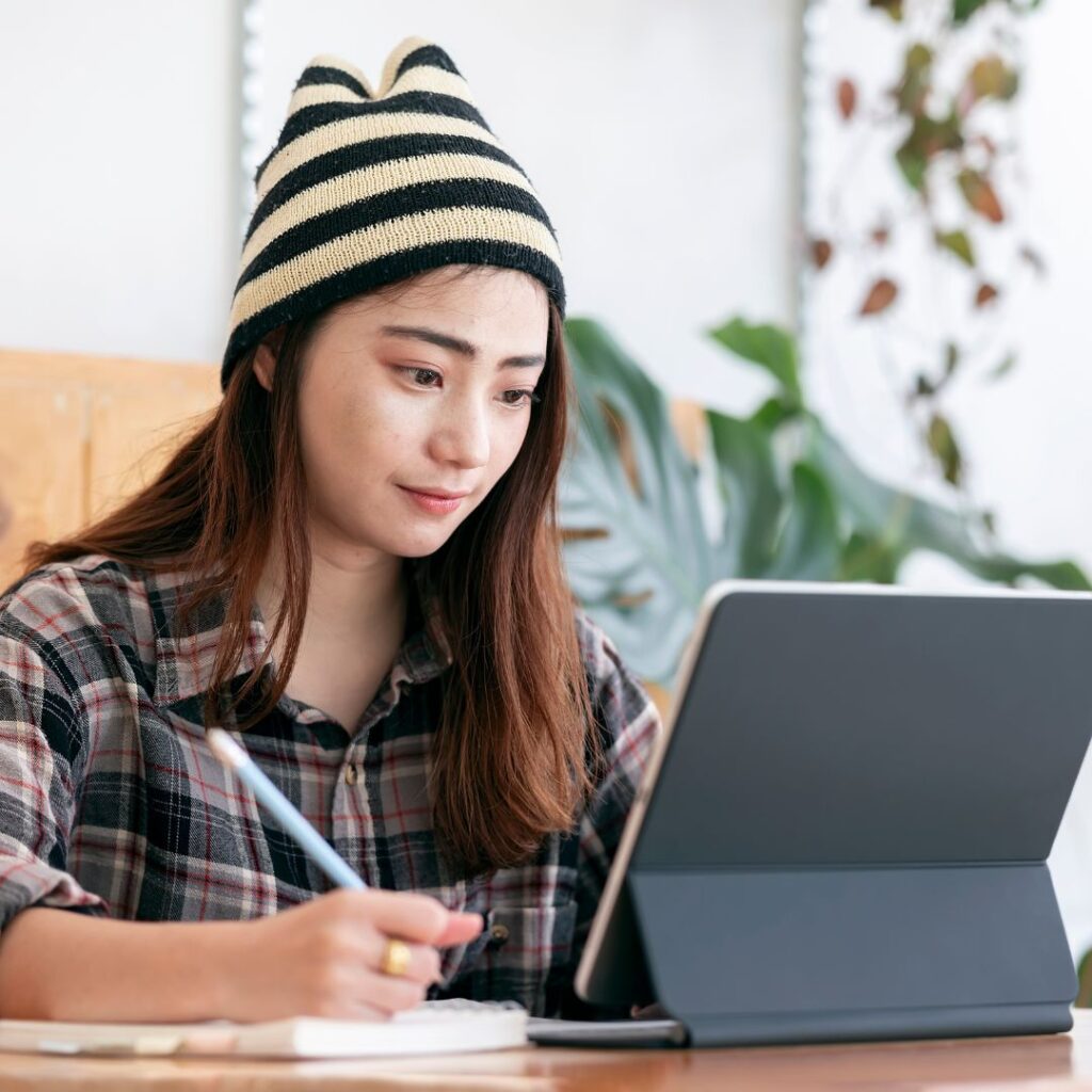 student working from her tablet