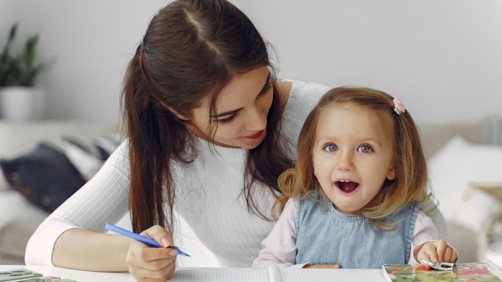 parent helping young student with writing