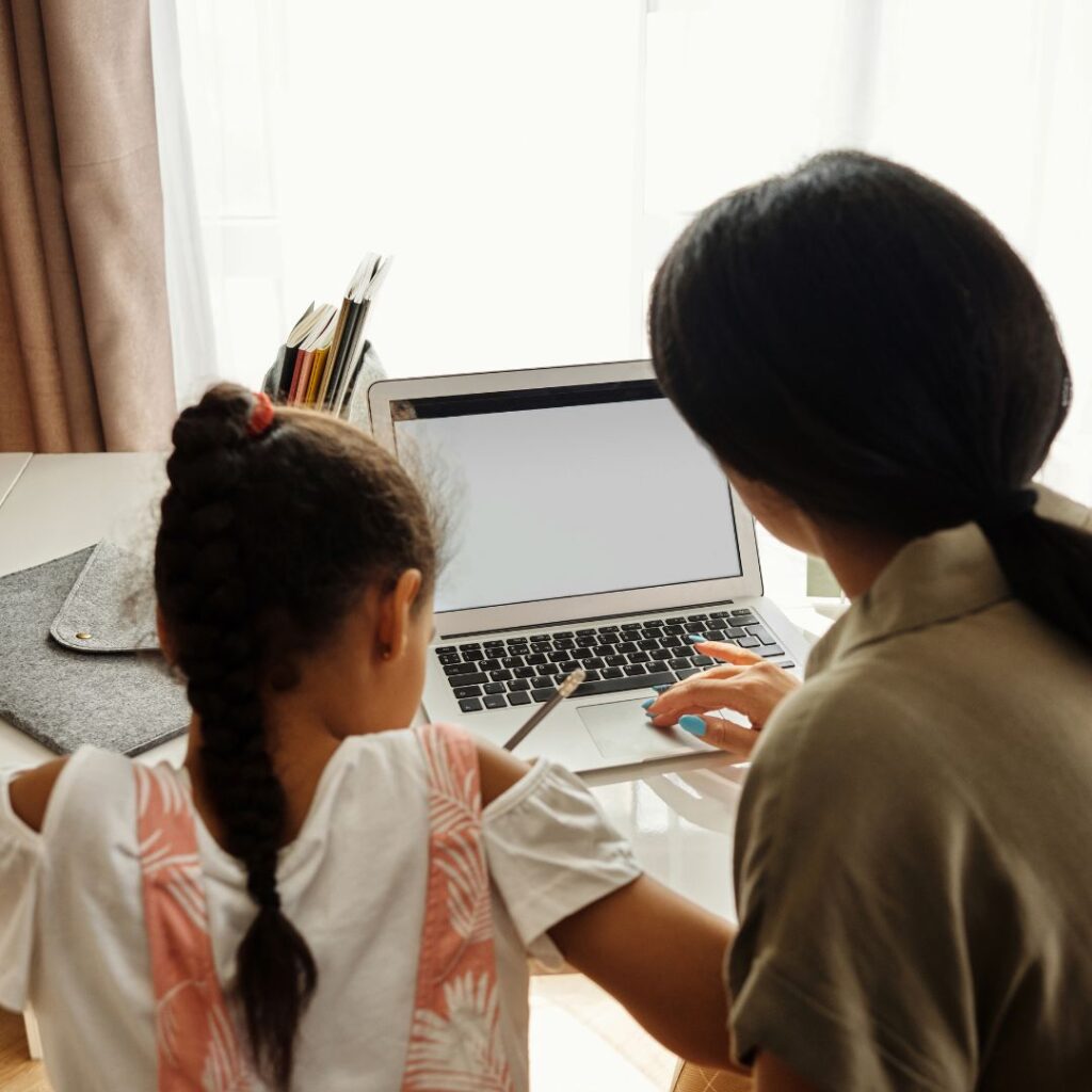 mom helping her child with writing courses