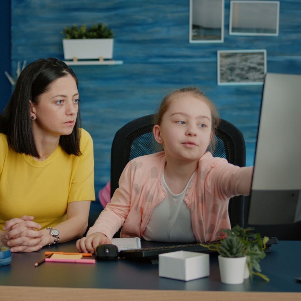 mom helping daughter with a writing course