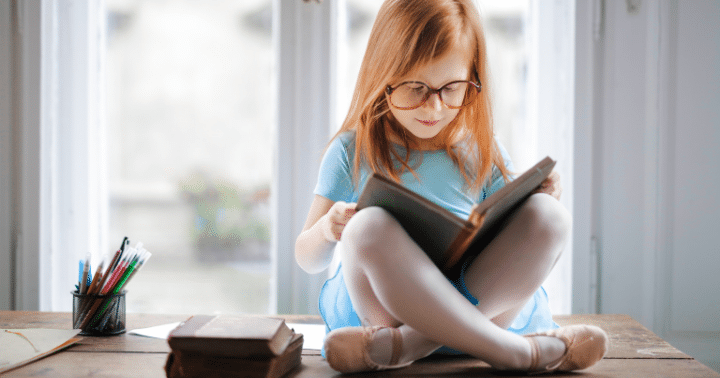 small girl reading a book