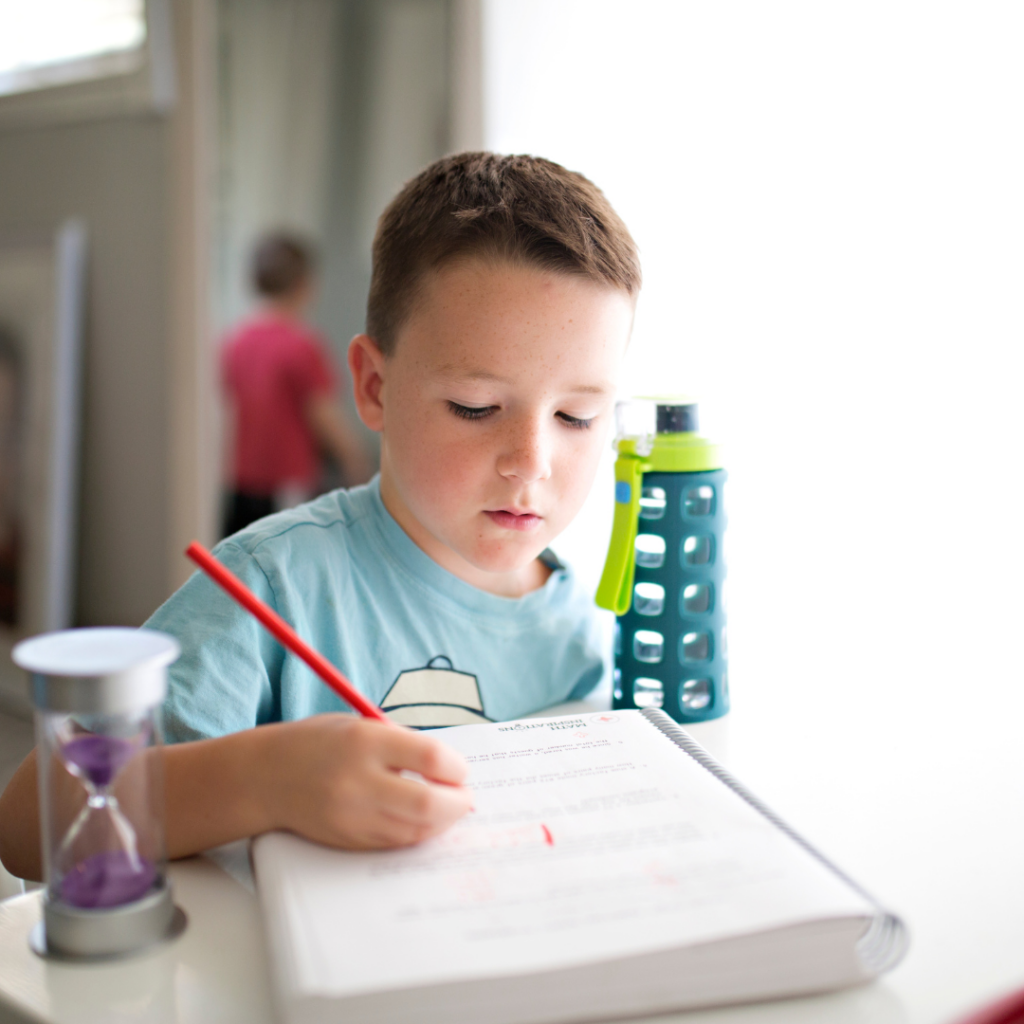 a boy looking at his writing homework